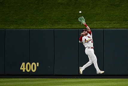 Jun 10, 2022; St. Louis, Missouri, USA;  St. Louis Cardinals center fielder Harrison Bader (48) leaps to catch a line drive against the Cincinnati Reds during the fourth inning at Busch Stadium. Mandatory Credit: Jeff Curry-USA TODAY Sports