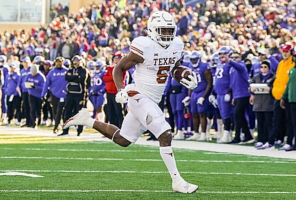 Nov 19, 2022; Lawrence, Kansas, USA; Texas Longhorns running back Bijan Robinson (5) runs for a touchdown during the first half against the Kansas Jayhawks at David Booth Kansas Memorial Stadium. Mandatory Credit: Jay Biggerstaff-USA TODAY Sports