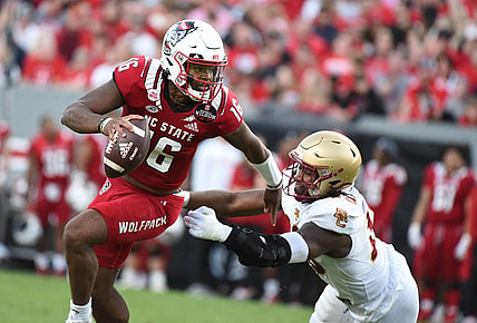 Nov 12, 2022; Raleigh, North Carolina, USA;North Carolina State Wolfpack quarterback MJ Morris (16) scrambles during the first half against the Boston College Eagles at Carter-Finley Stadium. Mandatory Credit: Rob Kinnan-USA TODAY Sports
