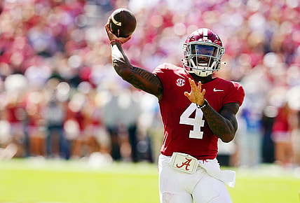 Oct 14, 2023; Tuscaloosa, Alabama, USA; Alabama Crimson Tide quarterback Jalen Milroe (4) rolls out to pass against the Arkansas Razorbacks during the second half at Bryant-Denny Stadium. Mandatory Credit: John David Mercer-USA TODAY Sports