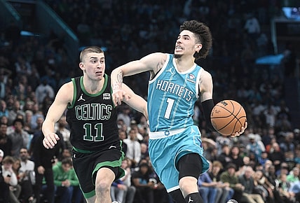 Nov 20, 2023; Charlotte, North Carolina, USA; Charlotte Hornets guard LaMelo Ball (1) drives past Boston Celtics guard Payton Pritchard (11) during the second half at the Spectrum Center. Mandatory Credit: Sam Sharpe-USA TODAY Sports