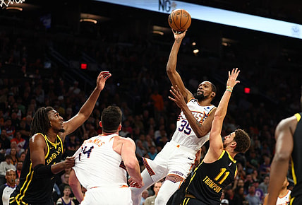 Nov 22, 2023; Phoenix, Arizona, USA; Phoenix Suns forward Kevin Durant (35) shoots the ball against the Golden State Warriors in the second half at Footprint Center. Mandatory Credit: Mark J. Rebilas-USA TODAY Sports