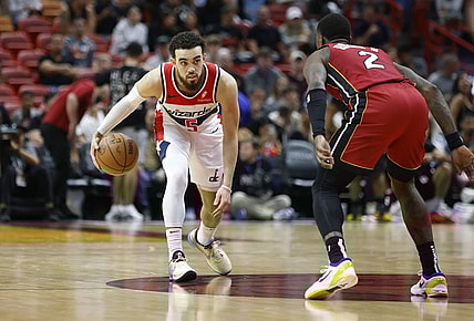 Mar 10, 2024; Miami, Florida, USA; Miami Heat guard Terry Rozier (2) defends Washington Wizards guard Tyus Jones (5) during the second half at Kaseya Center. Mandatory Credit: Rhona Wise-USA TODAY Sports