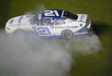 Feb 19, 2022; Daytona, FL, USA; Xfinity Series driver Austin Hill (21) celebrates winning the Xfinity Beef It's What's For Dinner 300 at Daytona International Speedway. Mandatory Credit: John David Mercer-USA TODAY Sports