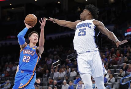 Mar 23, 2022; Oklahoma City, Oklahoma, USA; Oklahoma City Thunder forward Isaiah Roby (22) shoots as Orlando Magic forward Admiral Schofield (25) defends the shot during the second quarter at Paycom Center. Mandatory Credit: Alonzo Adams-USA TODAY Sports