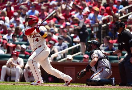 St. Louis Cardinals catcher Yadier Molina (4) hits a double against the San Francisco Giants during the second inning at Busch Stadium. Mandatory Credit: Jeff Curry-USA TODAY Sports
