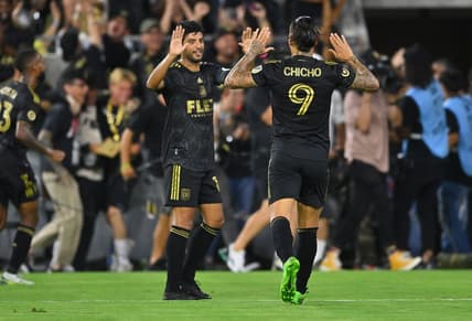 Aug 16, 2022; Los Angeles, California, USA; LAFC forward Carlos Vela (10) and forward Cristian Arango (9) high five after the combined assist to forward Kwadwo Opoku (not pictured) allowing him to score a goal in the second half at Banc of California Stadium. Mandatory Credit: Jayne Kamin-Oncea-USA TODAY Sports