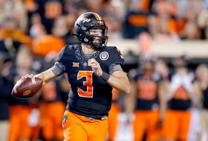 OSU quarterback Spencer Sanders looks to make a pass during a 37-33 win against OU last season.

cover