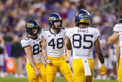 Oct 23, 2021; Fort Worth, Texas, USA; West Virginia Mountaineers place kicker Casey Legg (48) celebrates with teammates following a made field goal during the third quarter against the TCU Horned Frogs at Amon G. Carter Stadium. Mandatory Credit: Ben Queen-USA TODAY Sports