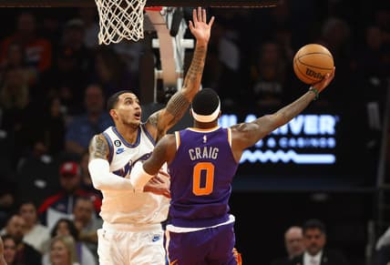 Dec 20, 2022; Phoenix, Arizona, USA; Washington Wizards forward Kyle Kuzma (left) defends against Phoenix Suns forward Torrey Craig in the first half at Footprint Center. Mandatory Credit: Mark J. Rebilas-USA TODAY Sports