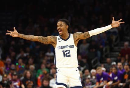 Dec 23, 2022; Phoenix, Arizona, USA; Memphis Grizzlies guard Ja Morant (12) celebrates a shot against the Phoenix Suns in the second half at Footprint Center. Mandatory Credit: Mark J. Rebilas-USA TODAY Sports