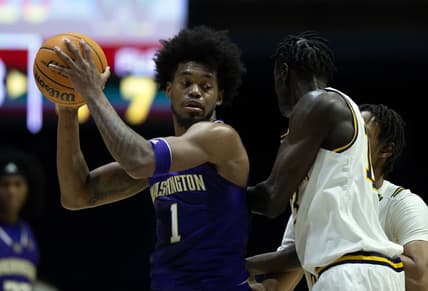 Feb 23, 2023; Berkeley, California, USA; Washington Huskies forward Keion Brooks Jr. (1) looks to pass around California Golden Bears forward Kuany Kuany (13) during the first half at Haas Pavilion. Mandatory Credit: D. Ross Cameron-USA TODAY Sports