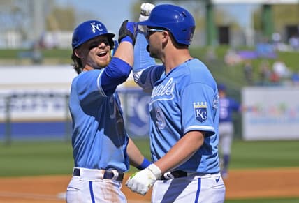 Feb 24, 2023; Surprise, Arizona, USA;  Kansas City Royals first baseman Vinnie Pasquantino (9) is congratulated by shortstop Bobby Witt Jr. (7) after a two run home run in the first inning of a spring training game against the Texas Rangers in Surprise, AZ. Mandatory Credit: Jayne Kamin-Oncea-USA TODAY Sports