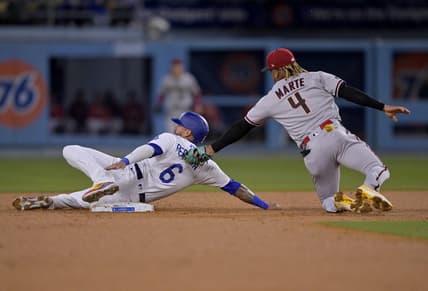 Mar 31, 2023; Los Angeles, California, USA;  Los Angeles Dodgers left fielder David Peralta (6) is tagged out by Arizona Diamondbacks second baseman Ketel Marte (4) on a stolen base attempt in the second inning at Dodger Stadium. Mandatory Credit: Jayne Kamin-Oncea-USA TODAY Sports