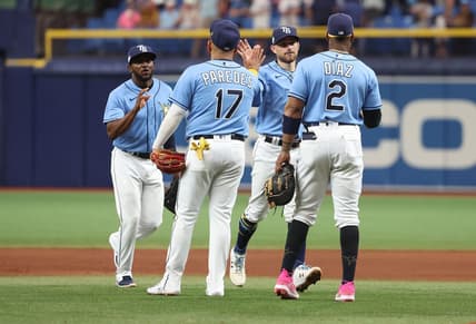 Apr 8, 2023; St. Petersburg, Florida, USA; Tampa Bay Rays second baseman Brandon Lowe (8), first baseman Yandy Diaz (2),  third baseman Isaac Paredes (17) and second baseman Vidal Brujan (7) celebrate after defeating the Oakland Athletics at Tropicana Field. Mandatory Credit: Kim Klement-USA TODAY Sports