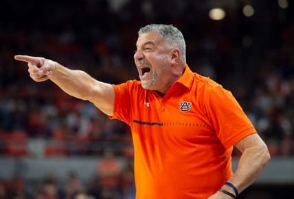Auburn Tigers head coach Bruce Pearl talks with his team as Auburn Tigers take on Arkansas Razorbacks at Neville Arena in Auburn, Ala., on Saturday, Jan. 7, 2023.