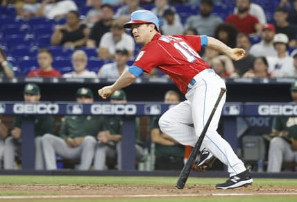 Jun 3, 2023; Miami, Florida, USA; Miami Marlins shortstop Joey Wendle (18) doubles against the Oakland Athletics during the second inning at loanDepot Park. Mandatory Credit: Rhona Wise-USA TODAY Sports