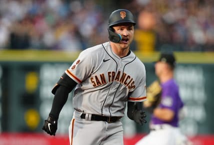 Jun 6, 2023; Denver, Colorado, USA; San Francisco Giants catcher Patrick Bailey (14) runs out a RBI triple in the third inning against the Colorado Rockies at Coors Field. Mandatory Credit: Ron Chenoy-USA TODAY Sports