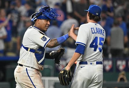 Aug 2, 2023; Kansas City, Missouri, USA;  Kansas City Royals catcher Salvador Perez (13) celebrates with relief pitcher Taylor Clarke (45) after the final out against the New York Mets at Kauffman Stadium. Mandatory Credit: Peter Aiken-USA TODAY Sports