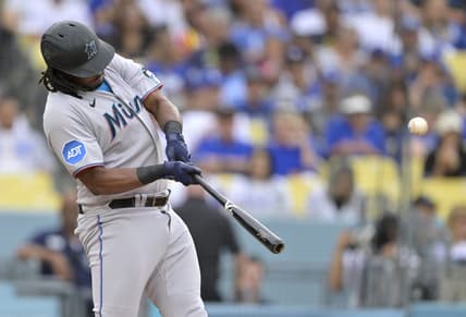 Aug 19, 2023; Los Angeles, California, USA;  Miami Marlins designated hitter Josh Bell (9) hits a solo home run in the first inning against the Los Angeles Dodgers at Dodger Stadium. Mandatory Credit: Jayne Kamin-Oncea-USA TODAY Sports