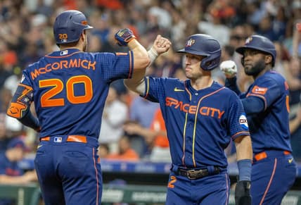 Aug 21, 2023; Houston, Texas, USA; Houston Astros third baseman Alex Bregman (2) and designated hitter Yordan Alvarez (44) celebrate left fielder Chas McCormick (20) three run home run against the Boston Red Sox in the fourth inning at Minute Maid Park. Mandatory Credit: Thomas Shea-USA TODAY Sports