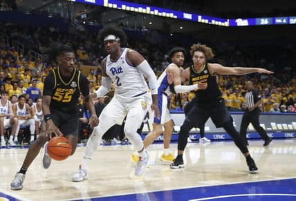 Nov 28, 2023; Pittsburgh, Pennsylvania, USA; Missouri Tigers guard Sean East II (55) drives the baseline against Pittsburgh Panthers forward Blake Hinson (2) during the first half at the Petersen Events Center. Mandatory Credit: Charles LeClaire-USA TODAY Sports