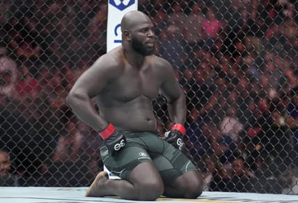 May 13, 2023; Charlotte, North Carolina, USA; Jairzinho Rozenstruik (red gloves) reacts after a loss to Jailton Almeida (blue gloves) in a heavyweight bout during UFC Fight Night at Spectrum Center. Mandatory Credit: Jim Dedmon-USA TODAY Sports