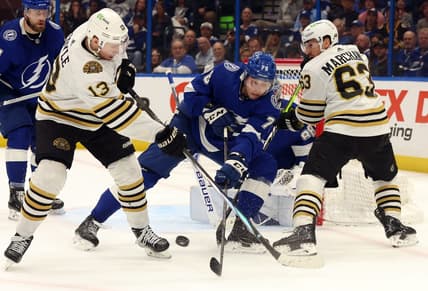 Mar 27, 2024; Tampa, Florida, USA; Tampa Bay Lightning defenseman Emil Martinsen Lilleberg (78) defends Boston Bruins center Charlie Coyle (13) and left wing Brad Marchand (63) during the second period at Amalie Arena. Mandatory Credit: Kim Klement Neitzel-USA TODAY Sports