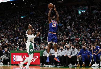 Dec 17, 2021; Boston, Massachusetts, USA; Golden State Warriors forward Andrew Wiggins (22) shoots past Boston Celtics guard Marcus Smart (36) during the first quarter at TD Garden. Mandatory Credit: Winslow Townson-USA TODAY Sports
