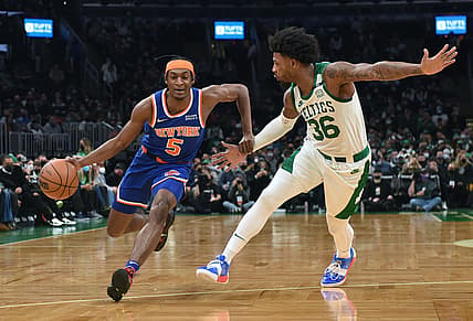 Jan 8, 2022; Boston, Massachusetts, USA;  New York Knicks guard Immanuel Quickley (5) controls the ball against Boston Celtics guard Marcus Smart (36) during the first half at TD Garden. Mandatory Credit: Bob DeChiara-USA TODAY Sports