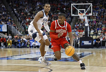 Mar 20, 2022; Pittsburgh, PA, USA; Ohio State Buckeyes forward E.J. Liddell (32) dribbles the ball around Villanova Wildcats forward Eric Dixon (43) in the first half during the second round of the 2022 NCAA Tournament at PPG Paints Arena. Mandatory Credit: Geoff Burke-USA TODAY Sports