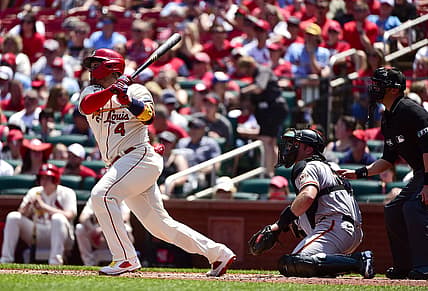 St. Louis Cardinals catcher Yadier Molina (4) hits a double against the San Francisco Giants during the second inning at Busch Stadium. Mandatory Credit: Jeff Curry-USA TODAY Sports