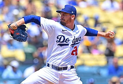 Jul 27, 2022; Los Angeles, California, USA; Los Angeles Dodgers starting pitcher Andrew Heaney (28) throws to the plate in the first inning against the Washington Nationals at Dodger Stadium. Mandatory Credit: Jayne Kamin-Oncea-USA TODAY Sports