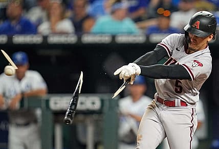 Aug 23, 2022; Kansas City, Missouri, USA; Arizona Diamondbacks center fielder Alek Thomas (5) breaks his bat as he hits a single against the Kansas City Royals during the sixth inning at Kauffman Stadium. Mandatory Credit: Jay Biggerstaff-USA TODAY Sports