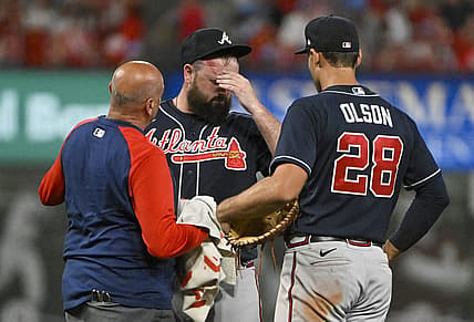 Aug 26, 2022; St. Louis, Missouri, USA;  Atlanta Braves relief pitcher Jackson Stephens (53) is checked on by a trainer and first baseman Matt Olson (28) after he was hit in the head by a line drive hit  by St. Louis Cardinals third baseman Brendan Donovan (not pictured) during the ninth inning at Busch Stadium. Mandatory Credit: Jeff Curry-USA TODAY Sports