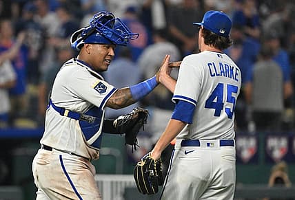 Aug 2, 2023; Kansas City, Missouri, USA;  Kansas City Royals catcher Salvador Perez (13) celebrates with relief pitcher Taylor Clarke (45) after the final out against the New York Mets at Kauffman Stadium. Mandatory Credit: Peter Aiken-USA TODAY Sports