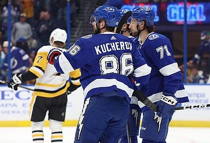 Dec 6, 2023; Tampa, Florida, USA; Tampa Bay Lightning center Anthony Cirelli (71) is congratulated by right wing Nikita Kucherov (86) and teammates after he scored a goal against the Pittsburgh Penguins during the first period at Amalie Arena. Mandatory Credit: Kim Klement Neitzel-USA TODAY Sports