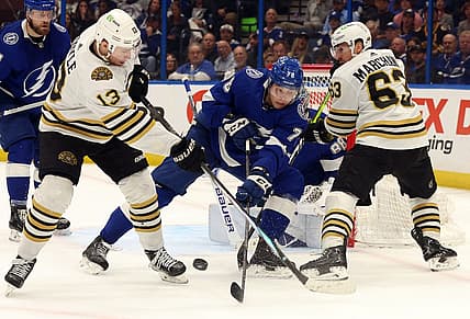 Mar 27, 2024; Tampa, Florida, USA; Tampa Bay Lightning defenseman Emil Martinsen Lilleberg (78) defends Boston Bruins center Charlie Coyle (13) and left wing Brad Marchand (63) during the second period at Amalie Arena. Mandatory Credit: Kim Klement Neitzel-USA TODAY Sports