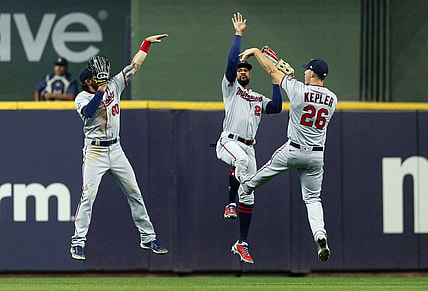 Apr 3, 2021; Milwaukee, Wisconsin, USA;  Minnesota Twins left fielder Jake Cave (60) and center fielder Byron Buxton (25) and right fielder Max Kepler (26) celebrate after defeating the Milwaukee Brewers at American Family Field. Mandatory Credit: Jeff Hanisch-USA TODAY Sports