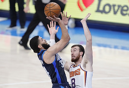 May 2, 2021; Oklahoma City, Oklahoma, USA; Oklahoma City Thunder forward Kenrich Williams (34) shoots as Phoenix Suns forward Frank Kaminsky (8) defends the shot during the third quarter at Chesapeake Energy Arena. Mandatory Credit: Alonzo Adams-USA TODAY Sports