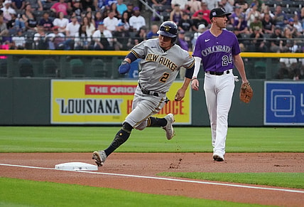 Jun 19, 2021; Denver, Colorado, USA; Milwaukee Brewers third baseman Luis Urias (2) heads home to score against the Colorado Rockies in the first inning at Coors Field. Mandatory Credit: Ron Chenoy-USA TODAY Sports