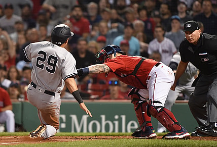 Jun 25, 2021; Boston, Massachusetts, USA;  Boston Red Sox catcher Christian Vazquez (7) tags ut New York Yankees third baseman Gio Urshela (29) during the fourth inning at Fenway Park. Mandatory Credit: Bob DeChiara-USA TODAY Sports