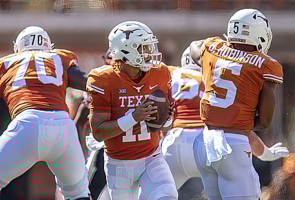 Sep 25, 2021; Austin, Texas, USA; Texas Longhorns quarterback Casey Thompson (11) looks to pass against the Texas Tech Red Raiders during the first quarter at Darrell K Royal-Texas Memorial Stadium. Mandatory Credit: John Gutierrez-USA TODAY Sports