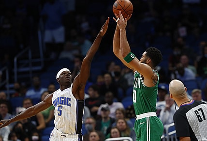 Nov 3, 2021; Orlando, Florida, USA; Boston Celtics forward Jayson Tatum (0) makes a three point basket against the Orlando Magic during the first quarter at Amway Center. Mandatory Credit: Kim Klement-USA TODAY Sports