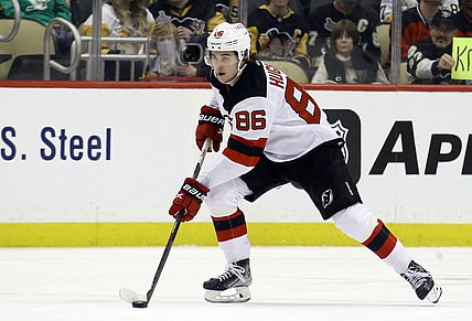 Feb 24, 2022; Pittsburgh, Pennsylvania, USA;  New Jersey Devils center Jack Hughes (86) skates up ice with the puck against the Pittsburgh Penguins during the first period at PPG Paints Arena. Mandatory Credit: Charles LeClaire-USA TODAY Sports