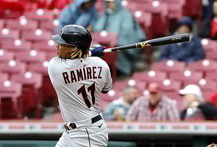 Apr 13, 2022; Cincinnati, Ohio, USA; Cleveland Guardians third baseman Jose Ramirez (11) hits a double against the Cincinnati Reds during the sixth inning at Great American Ball Park. Mandatory Credit: David Kohl-USA TODAY Sports