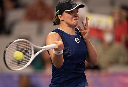 Nov 1, 2022; Forth Worth, TX, USA; Iga Swiatek (POL) returns a shot during her match against Daria Kasatkina on day two of the WTA Finals at Dickies Arena. Mandatory Credit: Susan Mullane-USA TODAY Sports