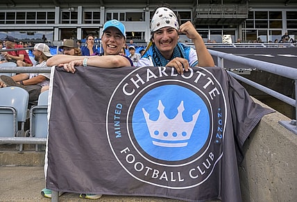 Jul 15, 2023; Montreal, Quebec, CAN; Charlotte FC fans Audrey and Lisa cheer on their team before the match between Charlotte FC and CF Montreal at Stade Saputo. Mandatory Credit: Eric Bolte-USA TODAY Sports