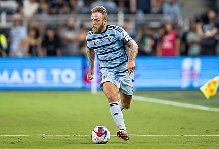 Jul 31, 2023; Kansas City, KS, USA; Sporting Kansas City forward Johnny Russell (7) controls the ball during the second half against Chivas Guadalajara at Children's Mercy Park. Mandatory Credit: Jay Biggerstaff-USA TODAY Sports