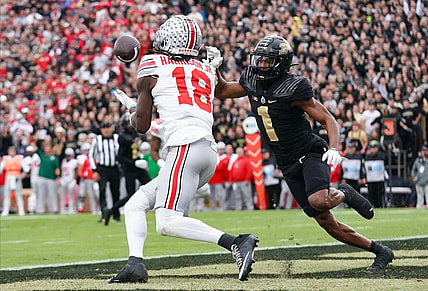 Oct 14, 2023; West Lafayette, Indiana, USA;  Ohio State Buckeyes wide receiver Marvin Harrison Jr. (18) catches a pass for a touchdown against Purdue Boilermakers defensive back Markevious Brown (1) during the first half at Ross-Ade Stadium. Mandatory Credit: Robert Goddin-USA TODAY Sports